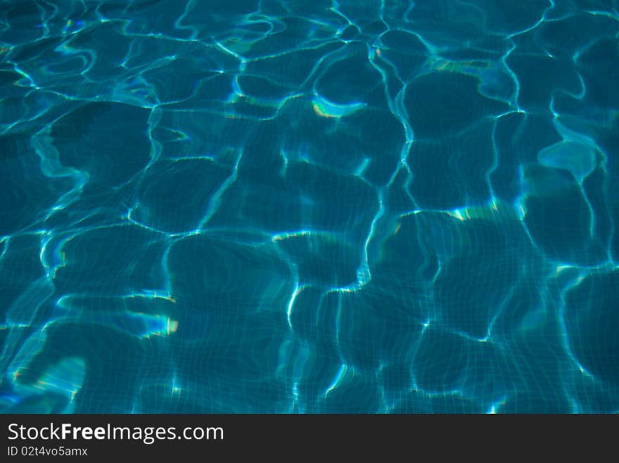 View of a swimming pool water surface. Photo taken with a polarizer filter. View of a swimming pool water surface. Photo taken with a polarizer filter.