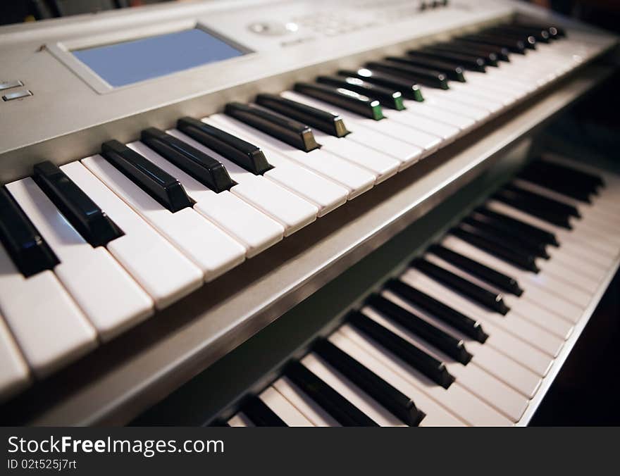 Close up image of two pianos