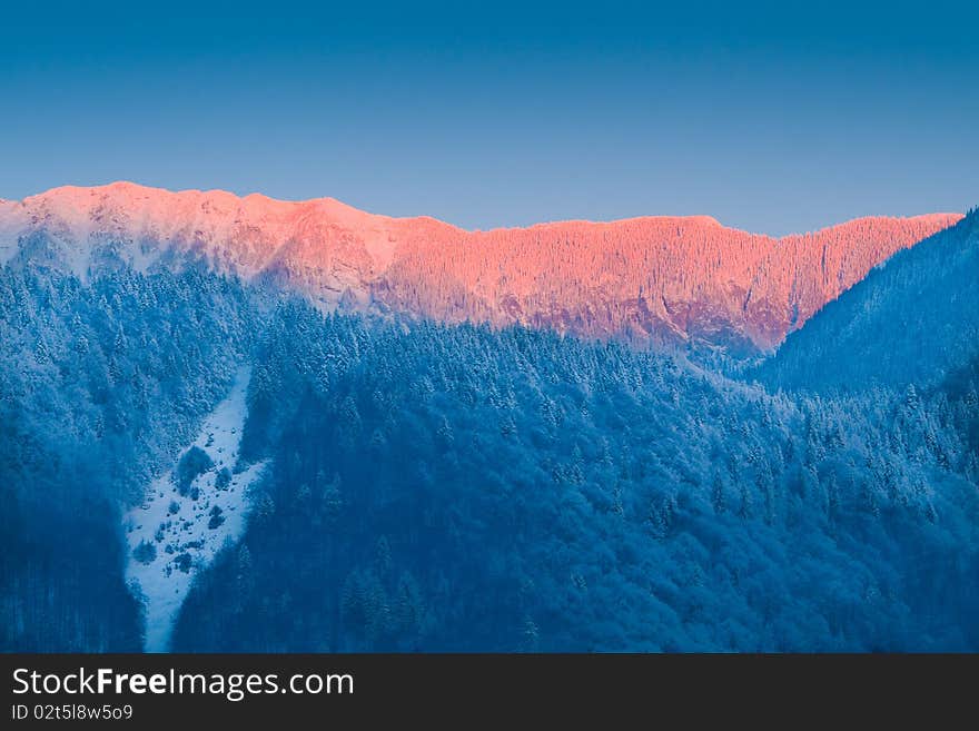 Sunrise in Winter Mountains