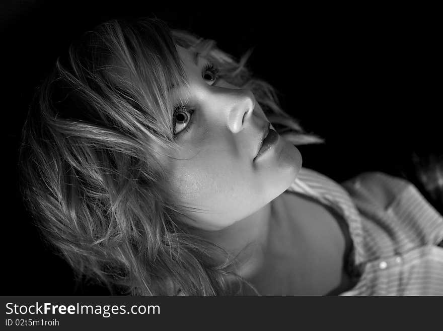 Beautiful blond woman on black background in BW. Beautiful blond woman on black background in BW