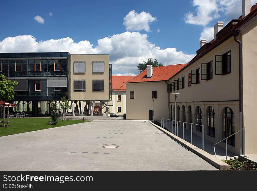 Modern building next to the historical building in center of Brno