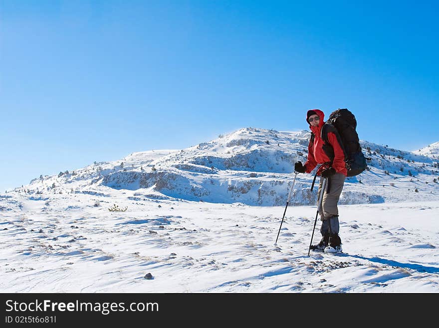 Hiker are in winter mountains