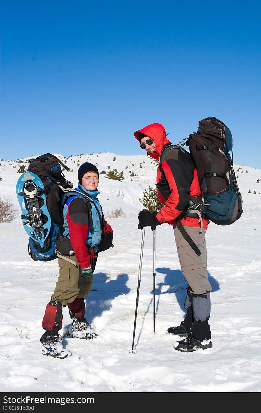 Hiker are in winter mountains