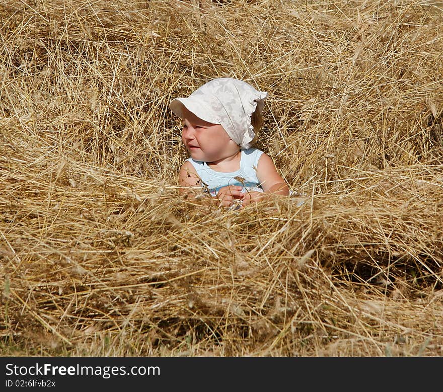 Little girl in hay