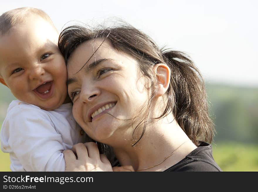 Happy mother with her smiling baby. Happy mother with her smiling baby