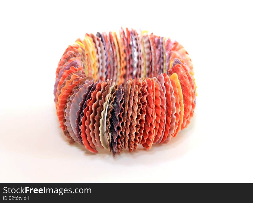 A multicolored seashell bracelet isolated on a white background.