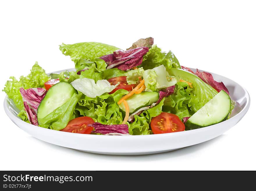 Salad with vegetables on white background