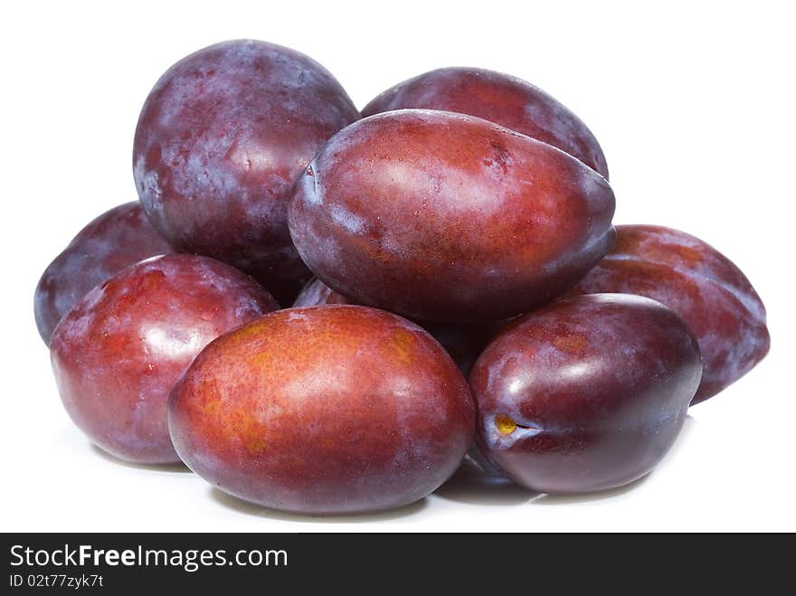 Fresh plums on white background