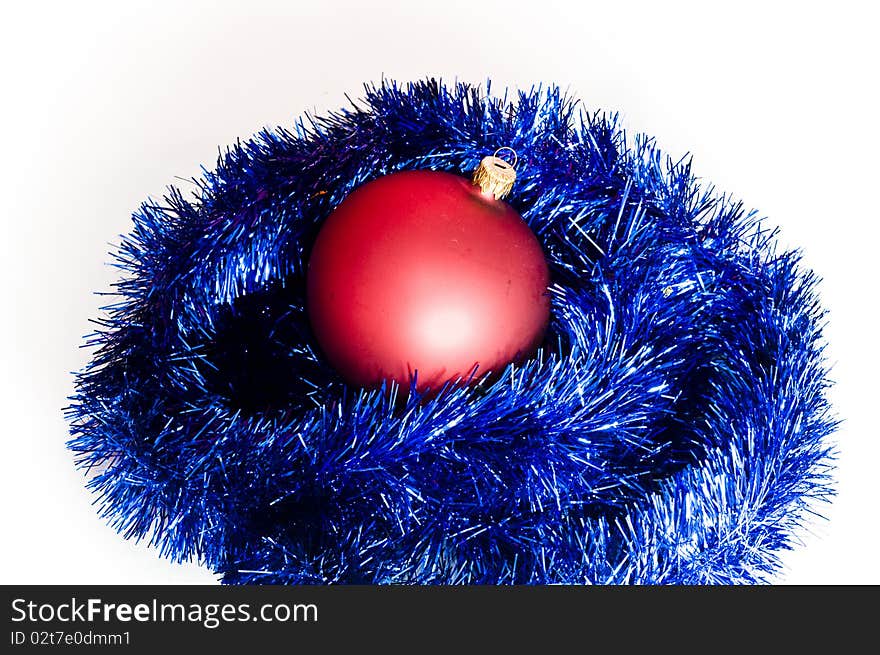 Red bomblet on blue christmas chain, isolated on white