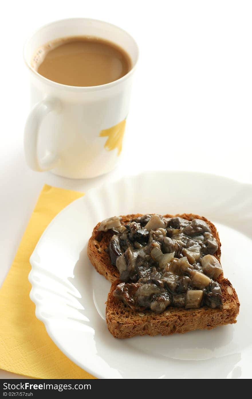 Toast with mushrooms paste and a cup of coffee