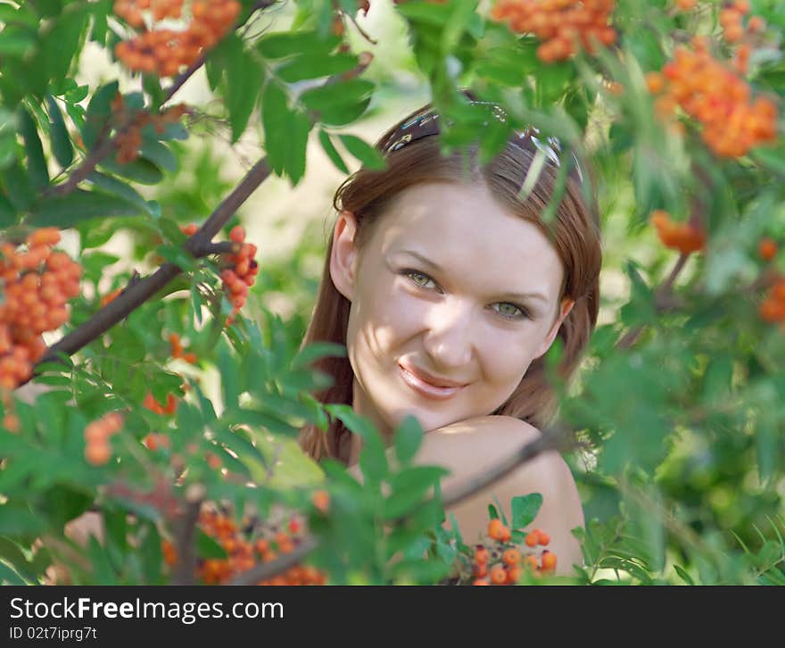 Beautiful girl in the forest with mountain ash. Shallow DOF. Beautiful girl in the forest with mountain ash. Shallow DOF.