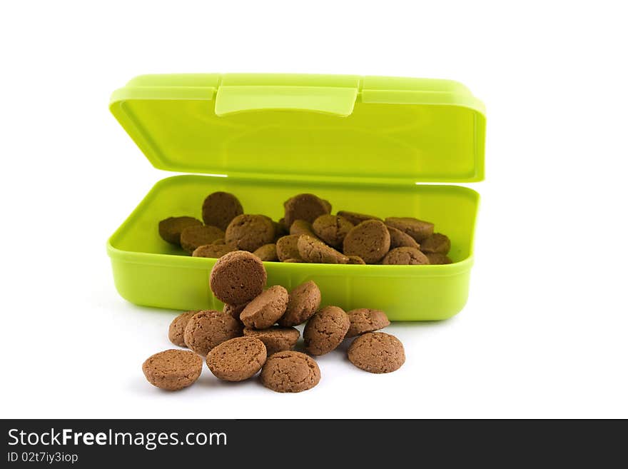 Gingernuts(pepernoten) isolated on white background in a container