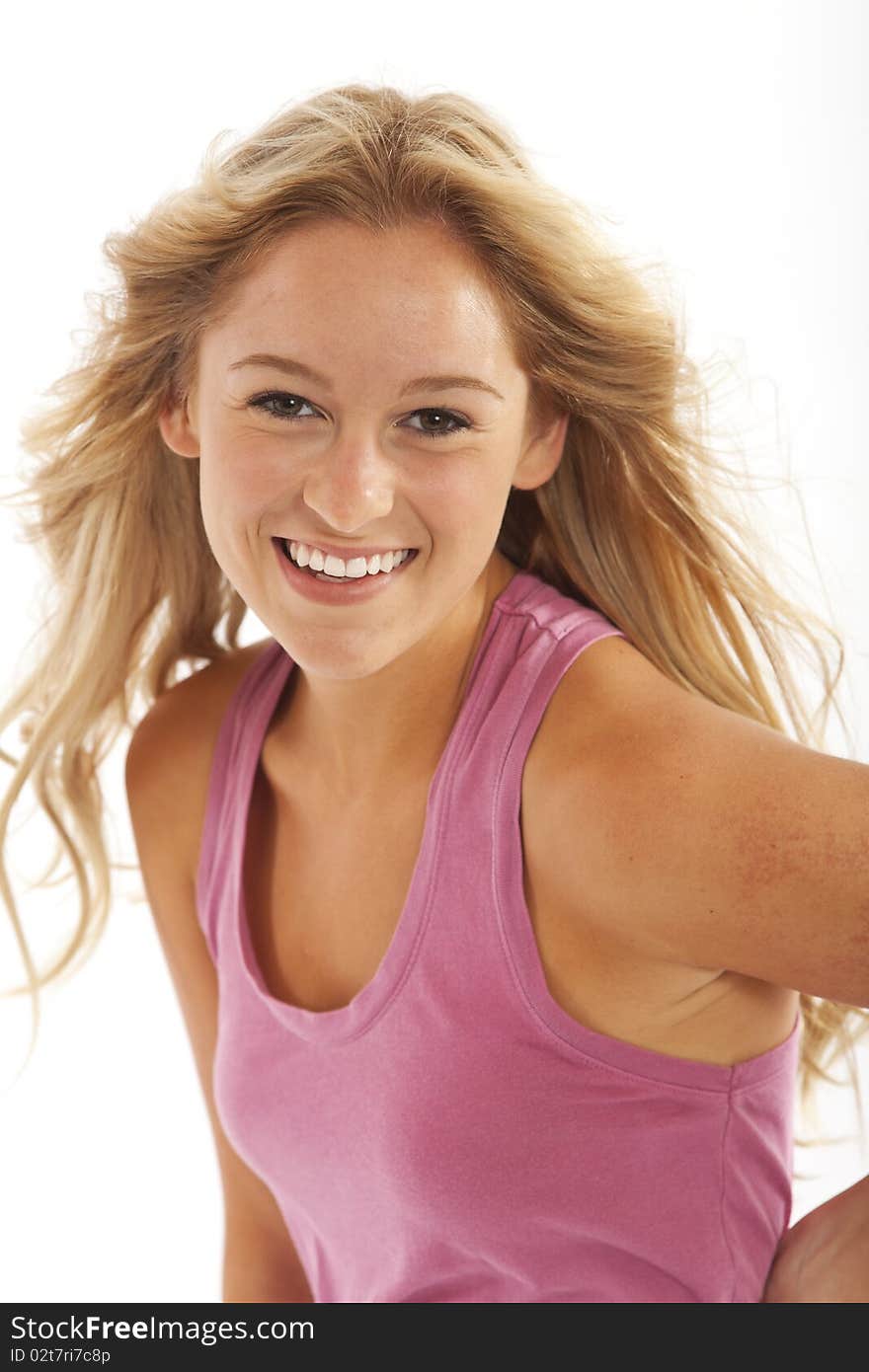 Portrait of teenager with long blond hair blowing in breeze