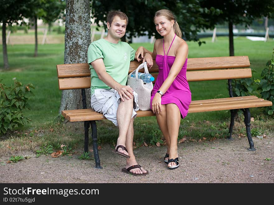 Young couple is relaxing in park. Young couple is relaxing in park