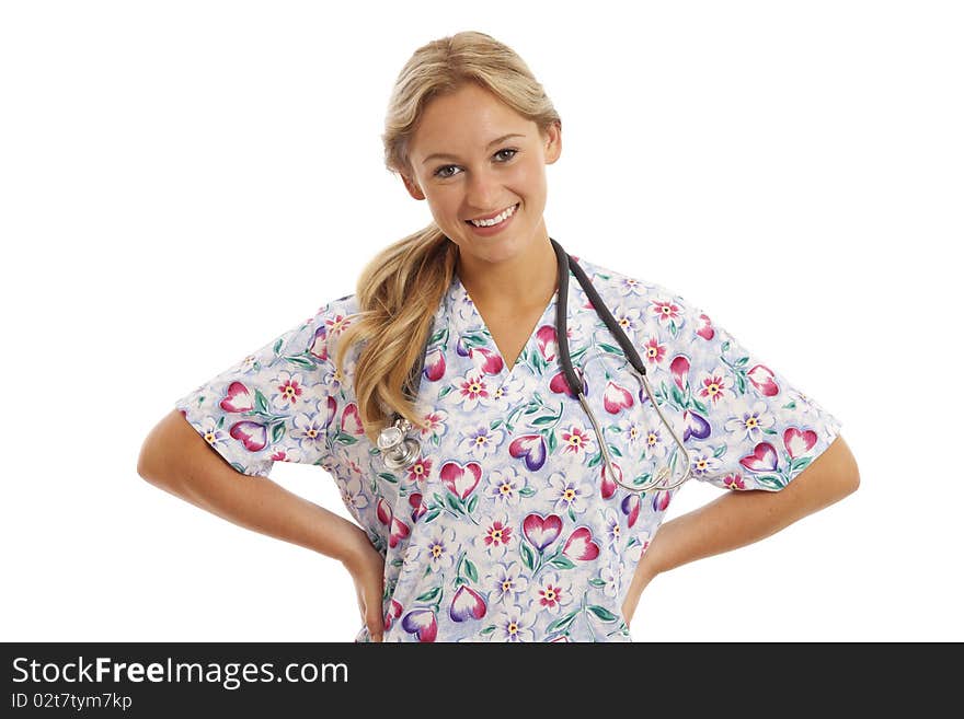 Portrait of young nurse with stethoscope in scrubs