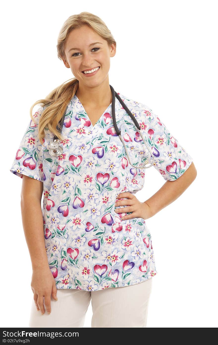 Portrait of young nurse with stethoscope in scrubs