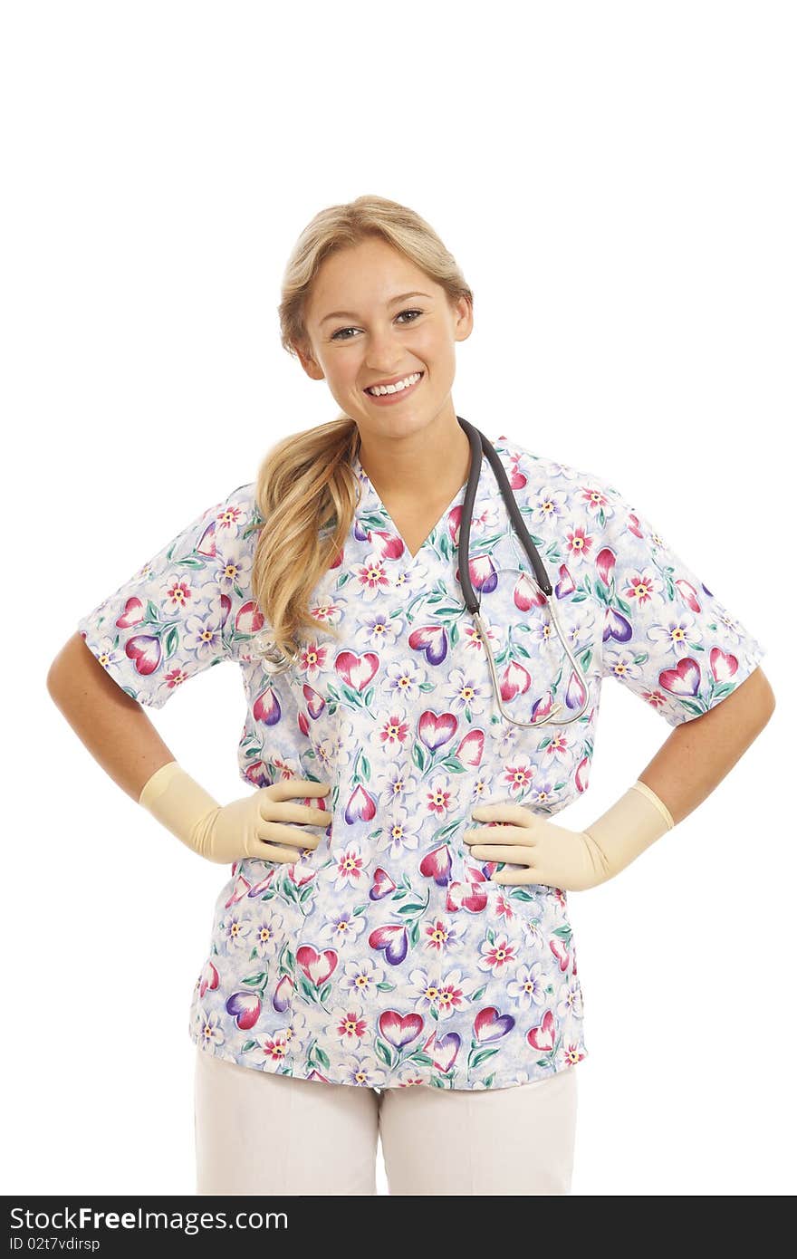 Portrait of young nurse with stethoscope putting on rubber glove