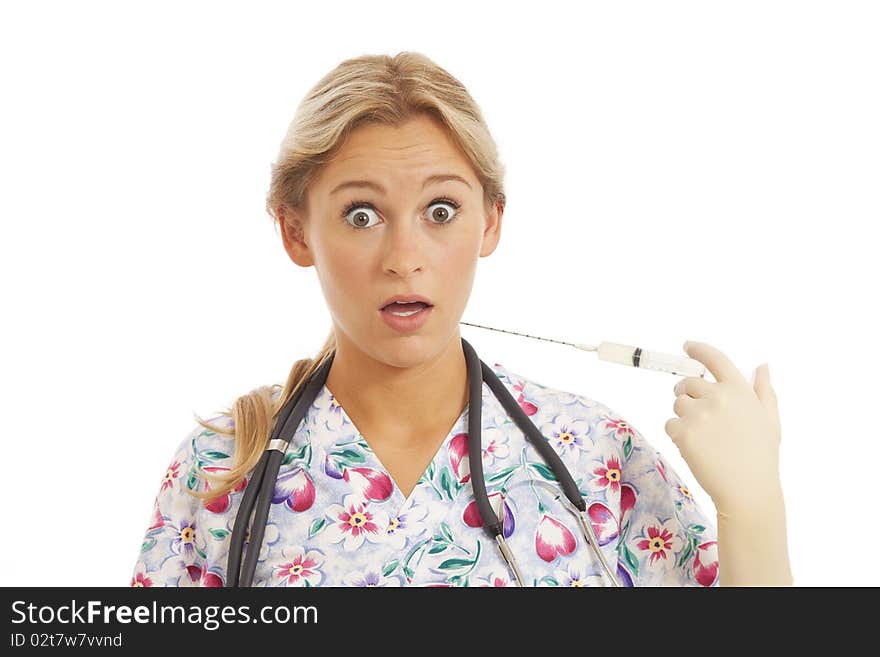 Humorous Portrait of young nurse with stethoscope and syringe