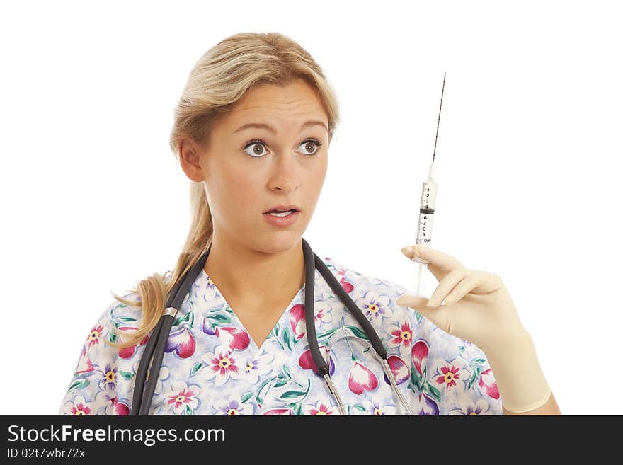 Humorous Portrait of young nurse with stethoscope and syringe