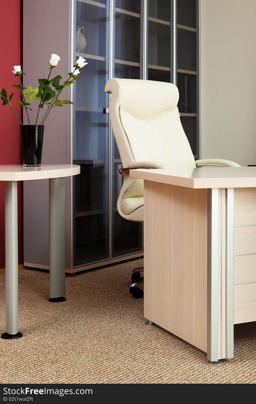 Leather armchair director in a modern office