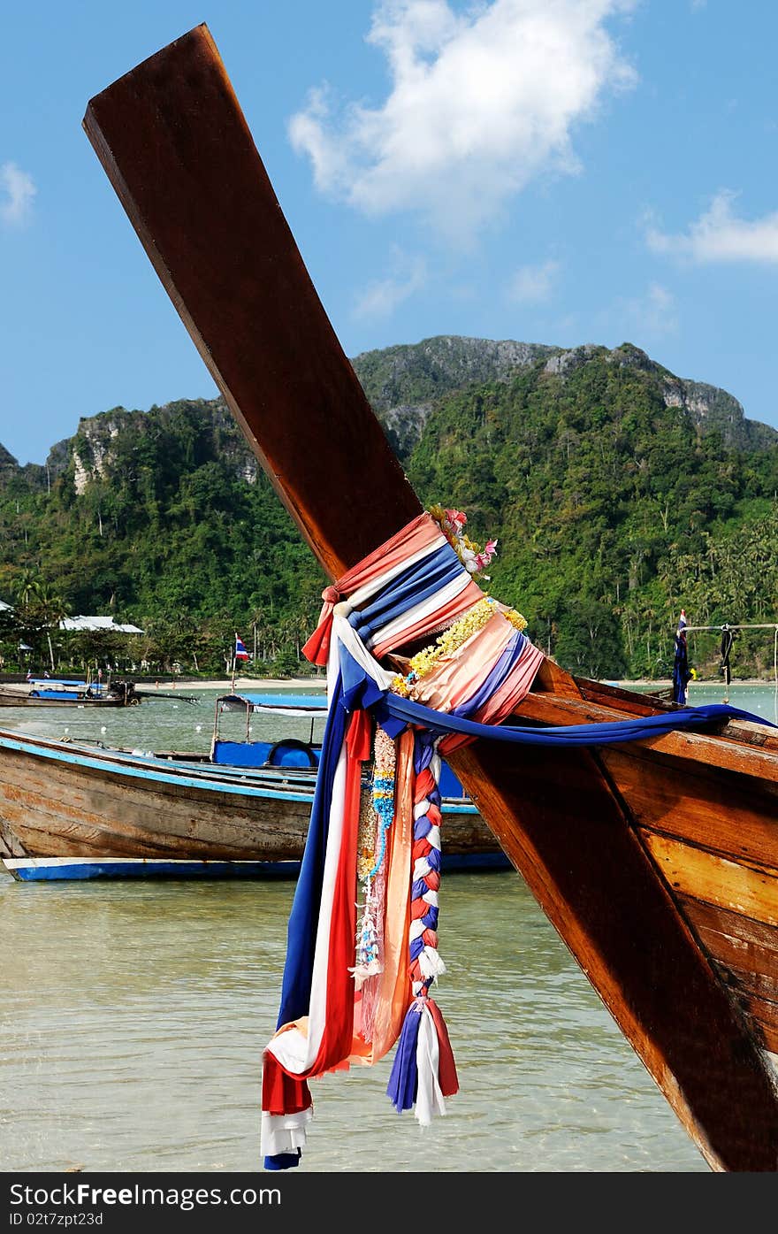 Long-tail boat in the Maya bay of Phi-Phi island. Long-tail boat in the Maya bay of Phi-Phi island