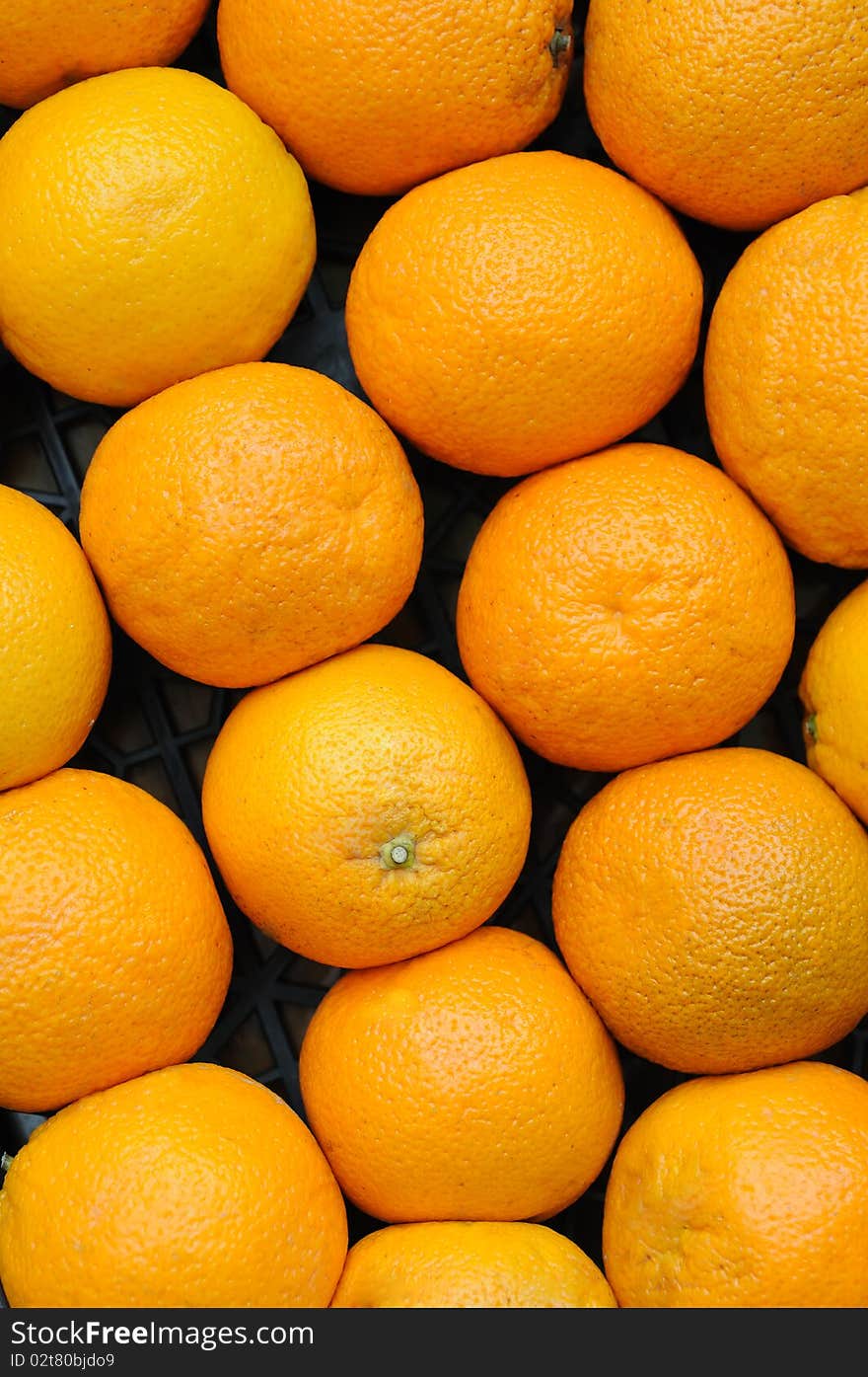 Fresh oranges on the market placed in box