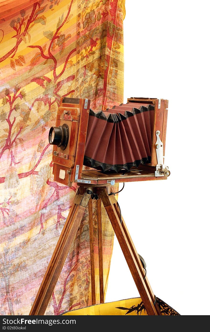 Beautifully crafted, vintage, wood and brass camera isolated over white. Beautifully crafted, vintage, wood and brass camera isolated over white