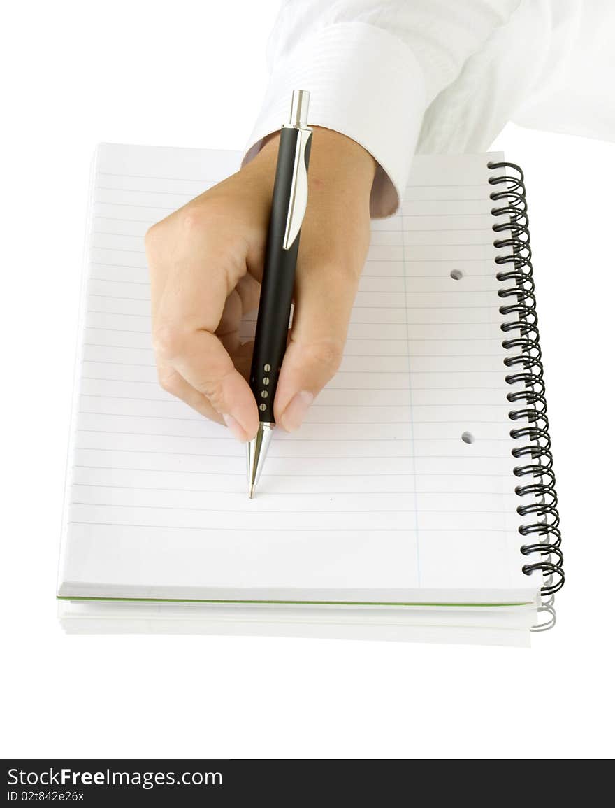 Pen in hand writing on the white page, isolated on white