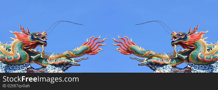 Pair of statue dragon on blue sky background. Pair of statue dragon on blue sky background