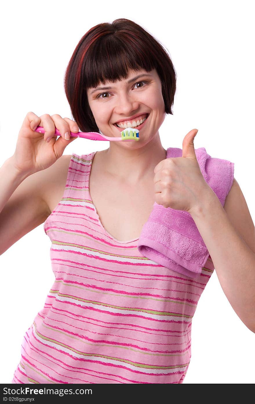 Beautiful girl holding up a toothbrush that contains tooth paste..Young Woman cleaning her teeth..