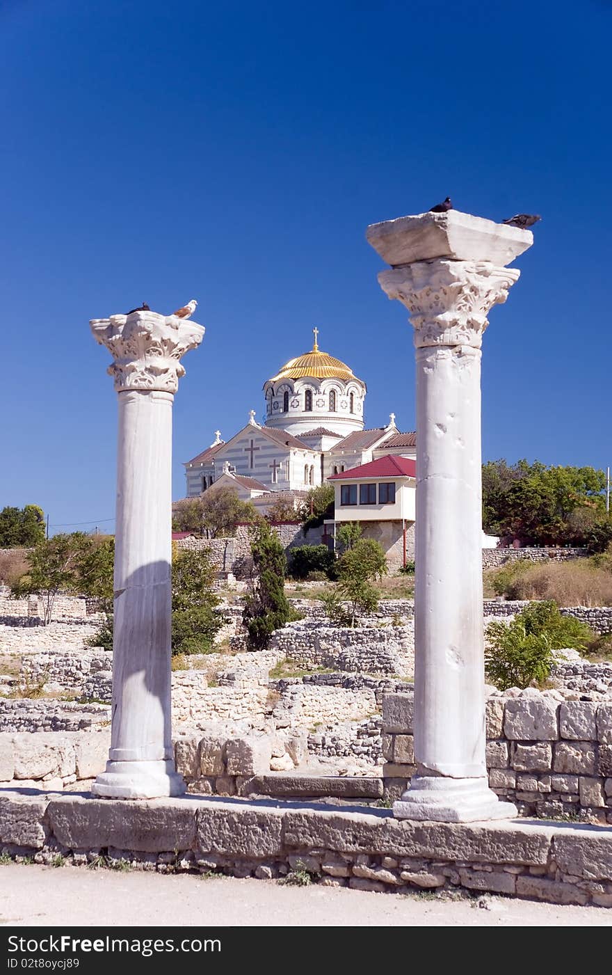 Ancient ruins against the church