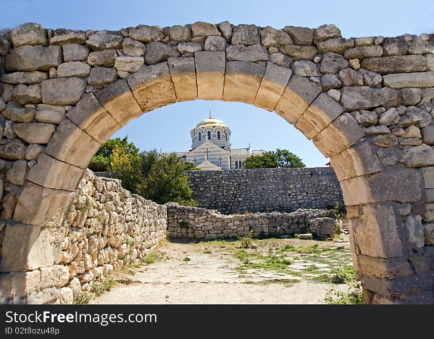 Ancient ruins against the church