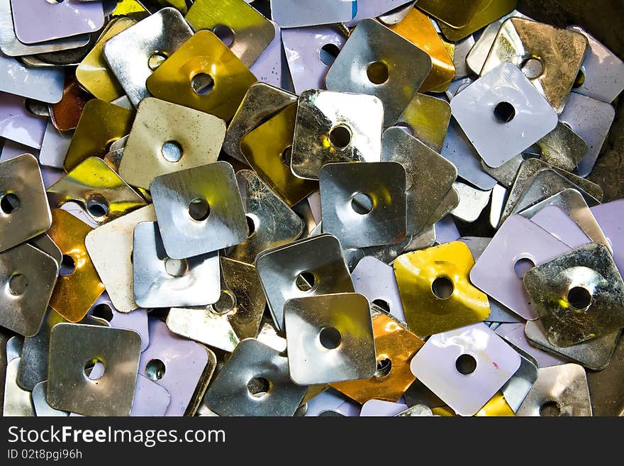 Heap of square Metal Nuts