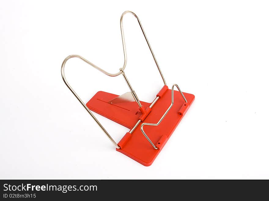 Metal bookend with the red plastic basis on a white background