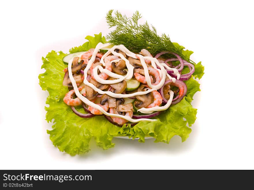 Salad from shrimps with field mushrooms, apples and cucumbers.