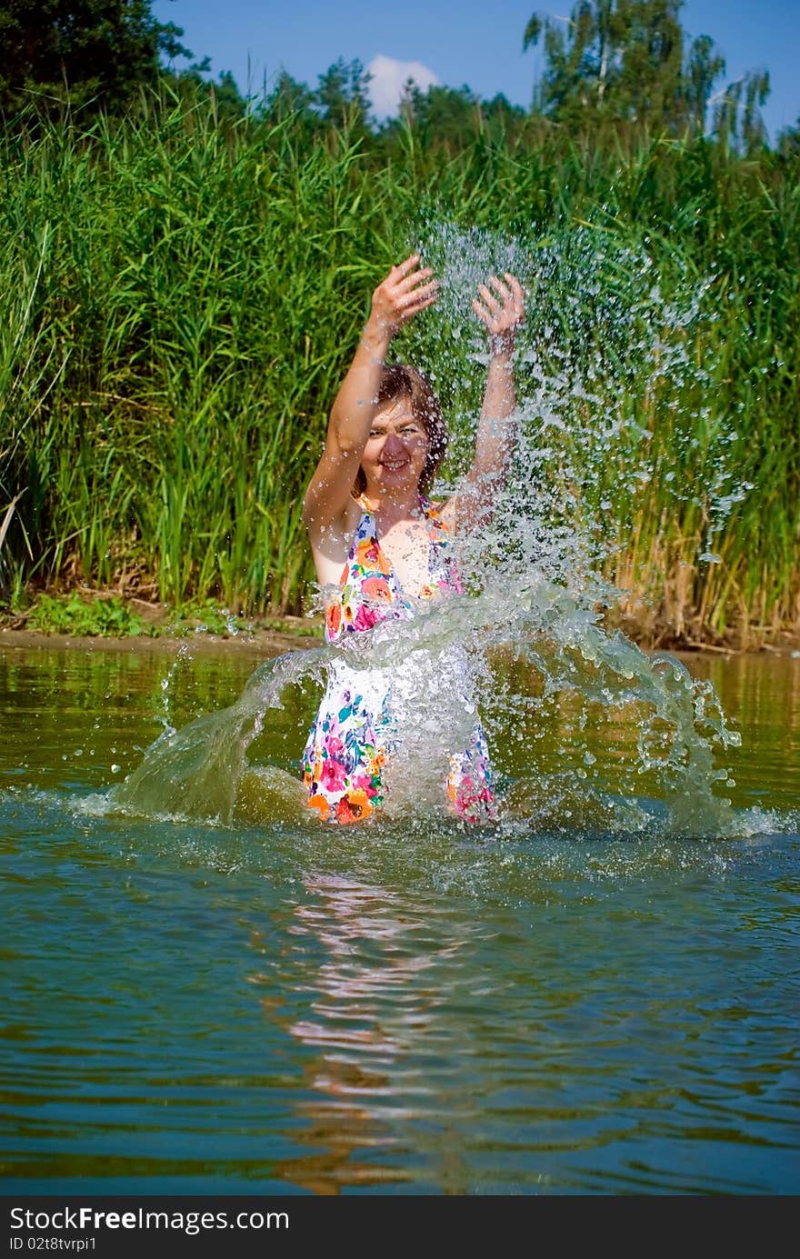 Beautiful girl playing in water. Beautiful girl playing in water