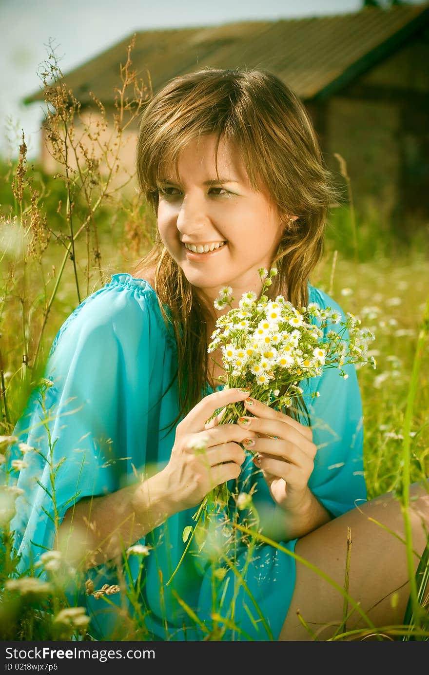 Girl sitting in a field