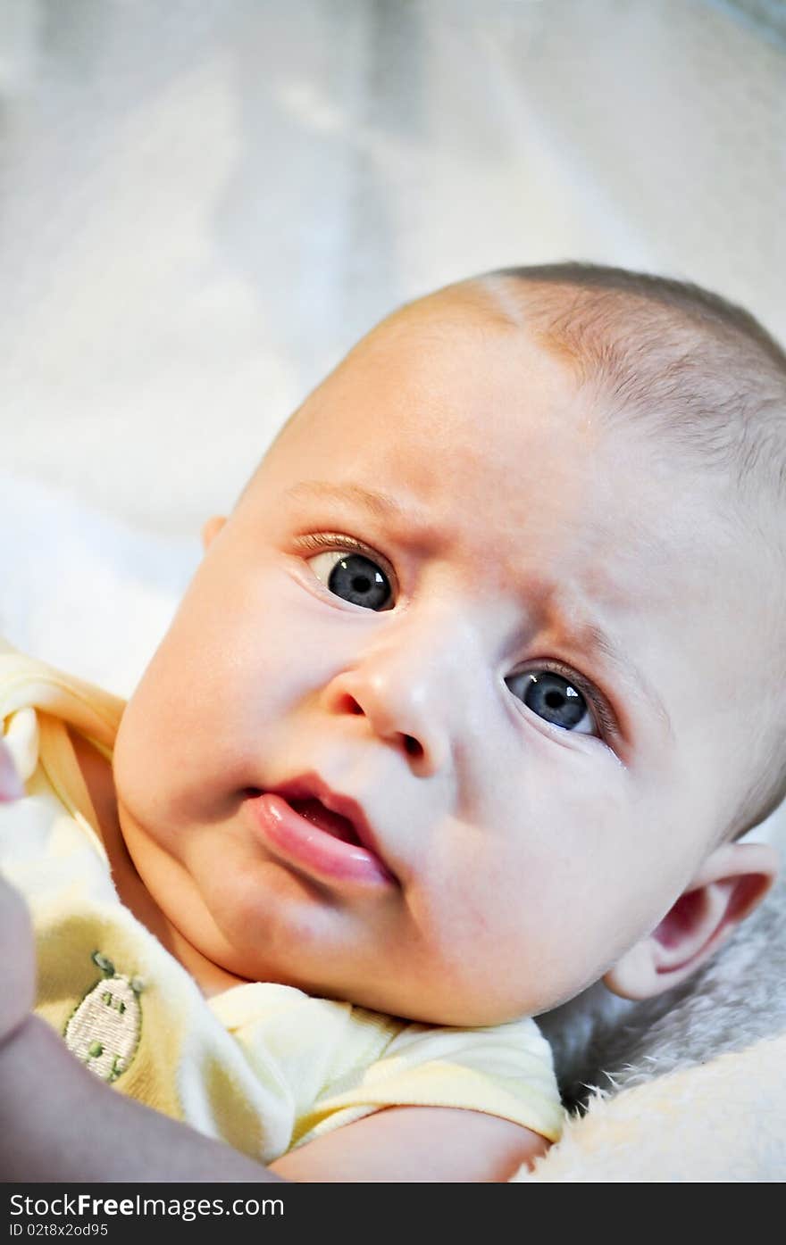 portrait of a baby with big blue eyes. portrait of a baby with big blue eyes