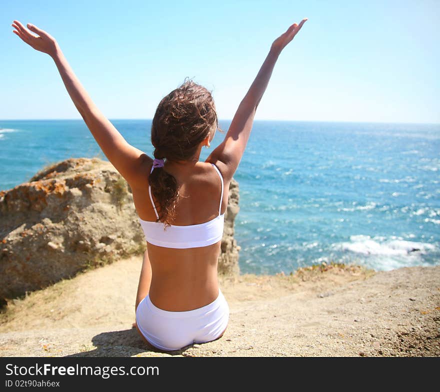 Beautiful brunette is happy on the beach. Beautiful brunette is happy on the beach