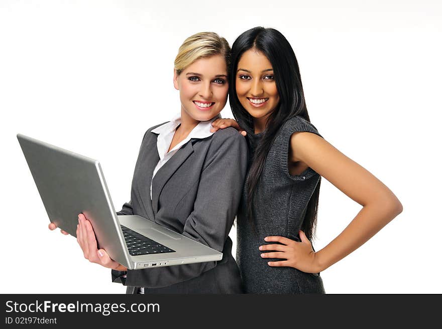 young businesswomen pose with laptop. young businesswomen pose with laptop