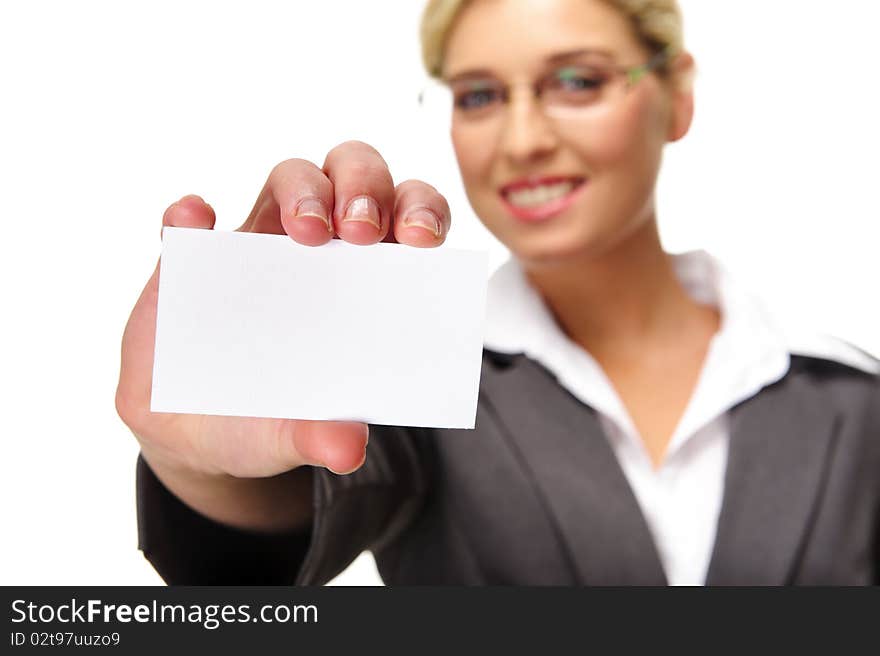 Blonde businesswoman shows her card to the camera, selective focus on business card.