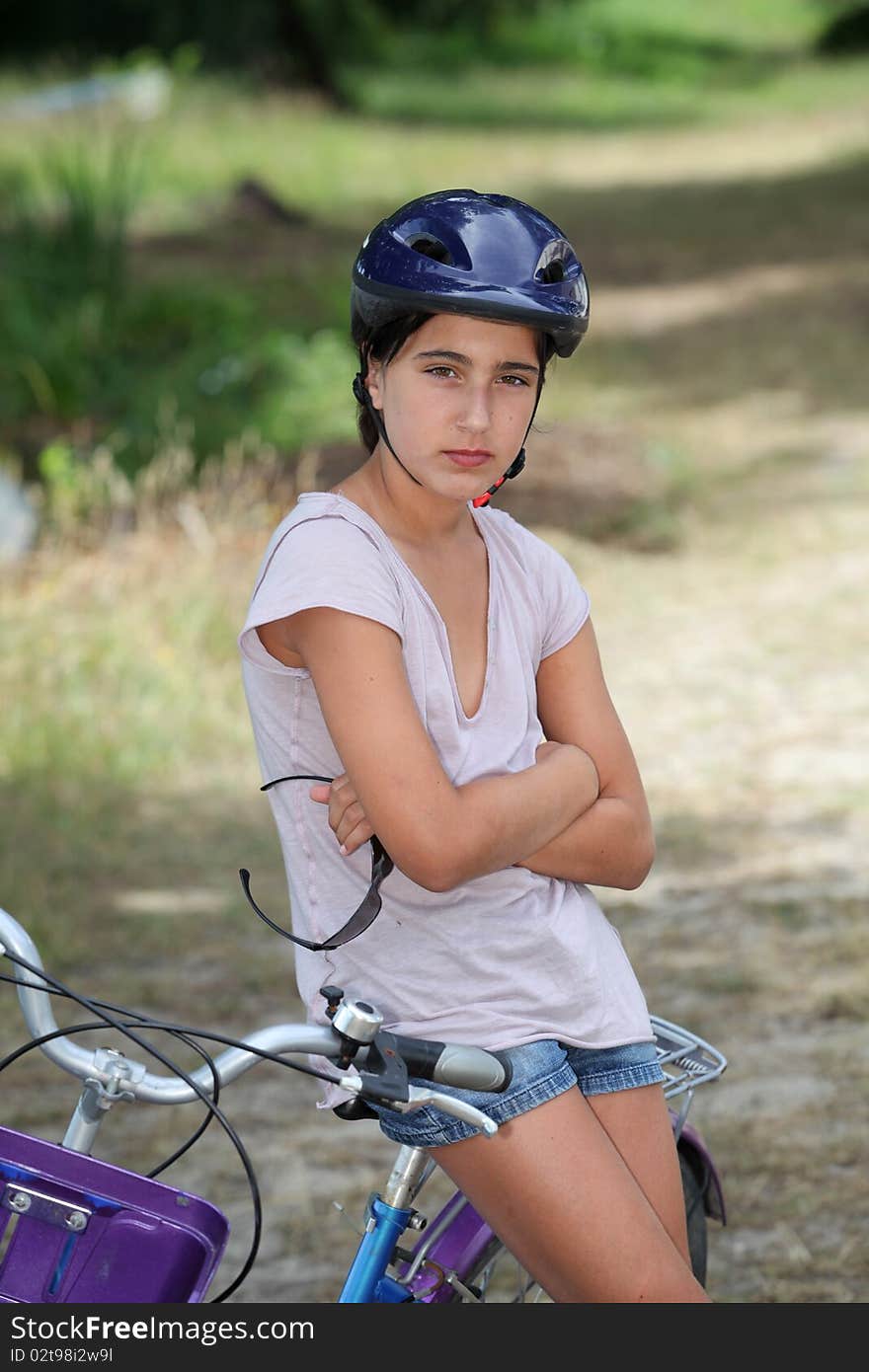 Girl sitting on a bicycle. Girl sitting on a bicycle