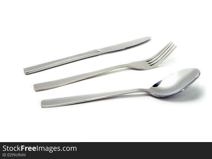 Fork, spoon and knife isolated on white background