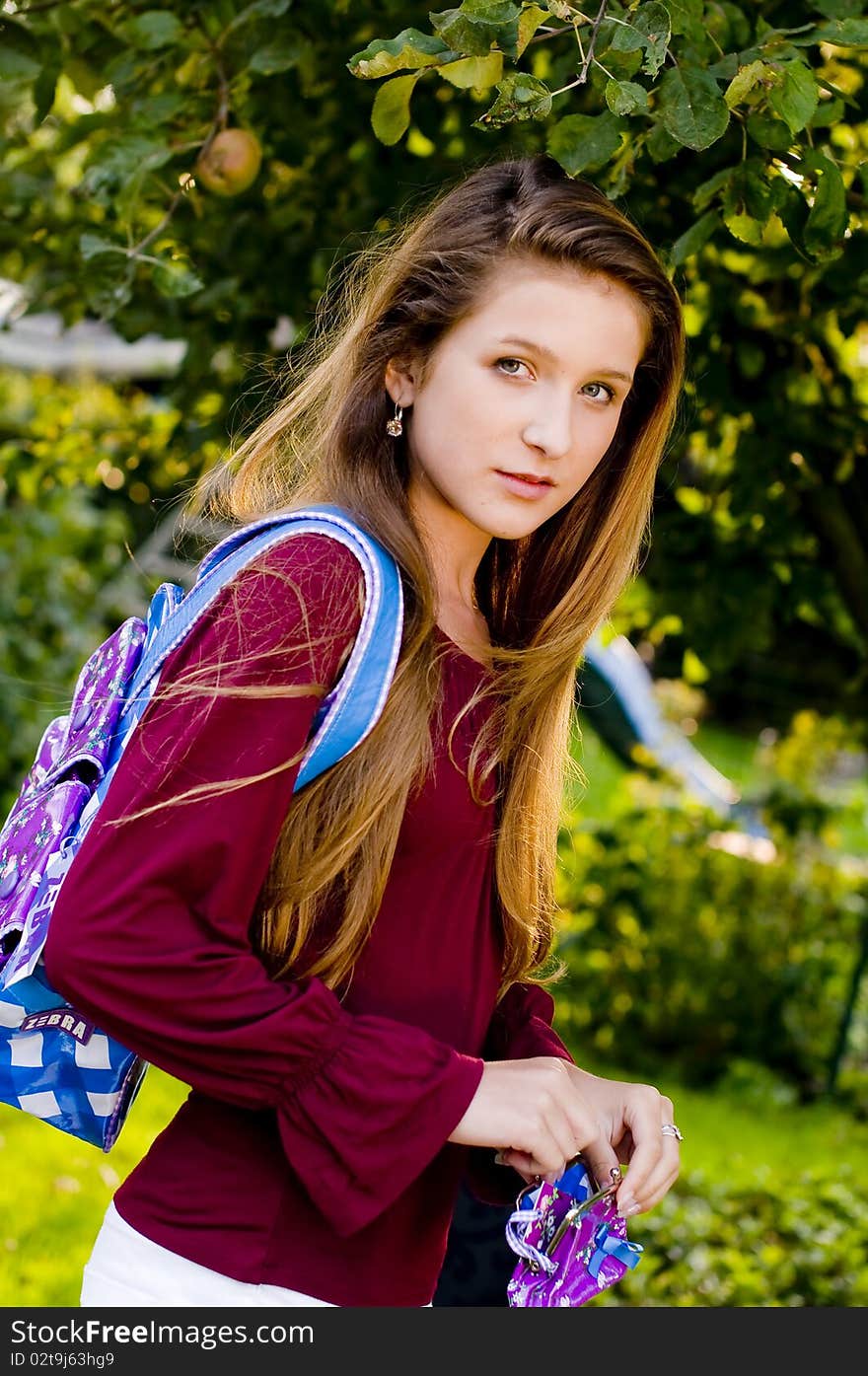 Back to school fashion girl showing bags and accessories