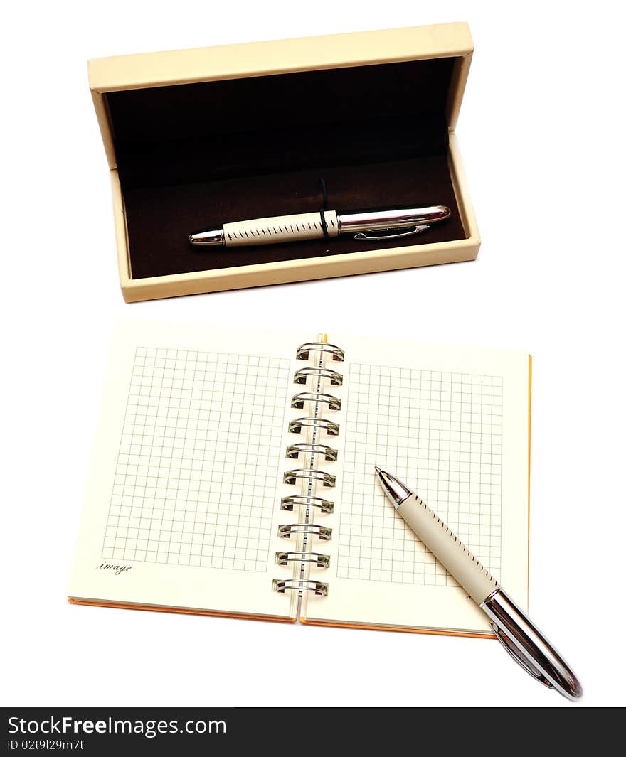 Open spiral bound notebook with pen