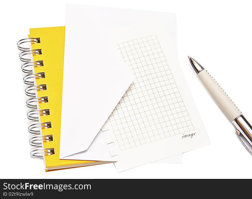 White envelope spiral notepad and pen isolated on a white