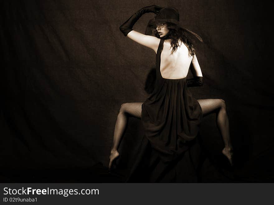 Girl in hat against black background. Girl in hat against black background