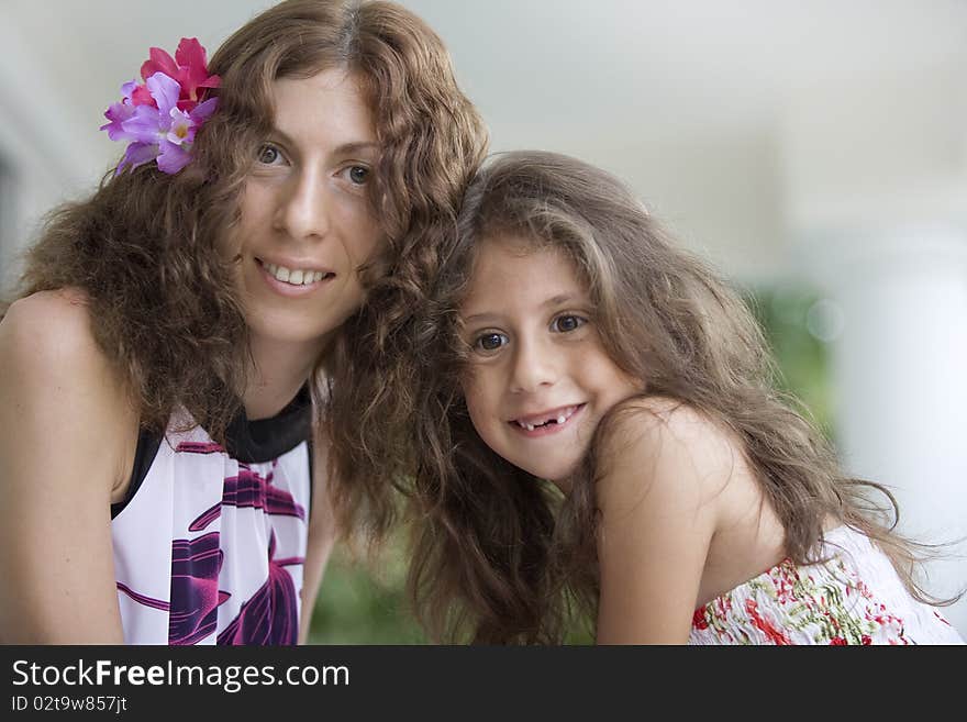 Portrait of happy mother with daughter  having good time in summer environment. Portrait of happy mother with daughter  having good time in summer environment