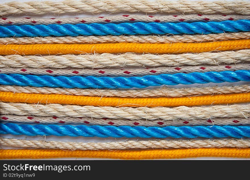 A selection of ropes arranged on a white background. A selection of ropes arranged on a white background.