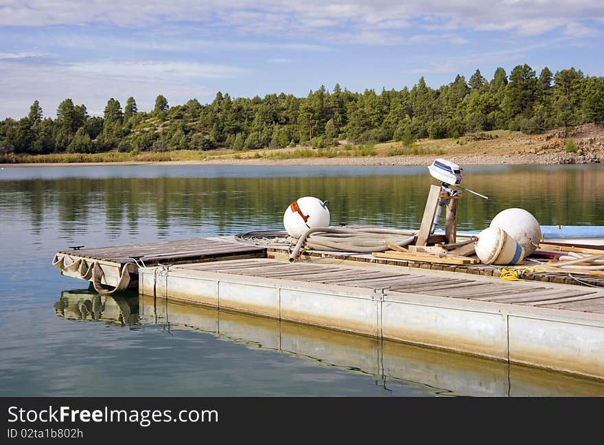 Floats sit on the lakeside dock in the early morning light. Floats sit on the lakeside dock in the early morning light